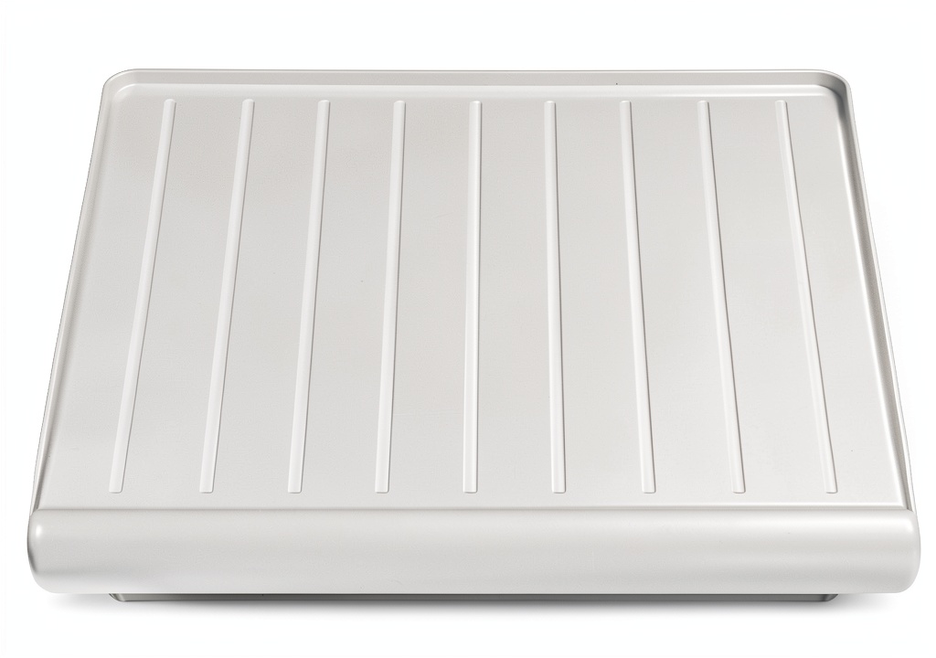 GE refrigerator crisper pan cover installed in a modern kitchen